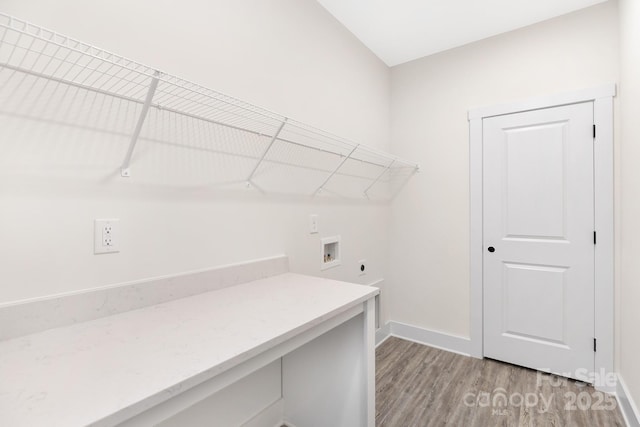 washroom with laundry area, baseboards, hookup for a washing machine, light wood-type flooring, and hookup for an electric dryer