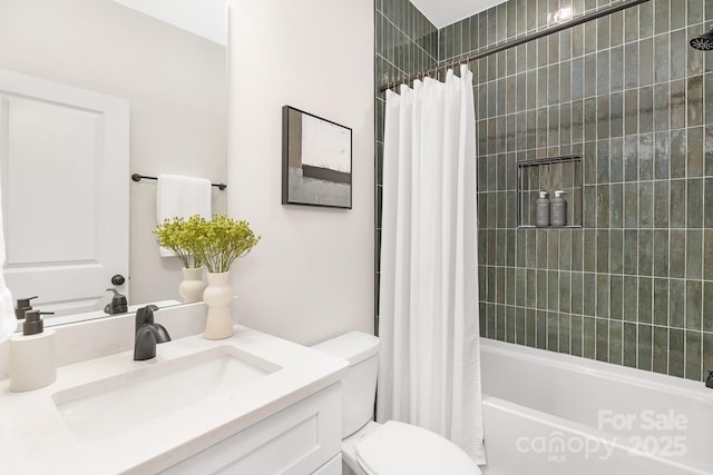 bathroom with vanity, shower / bath combo with shower curtain, and toilet