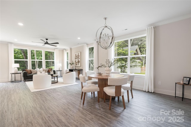 8937 Penstemons Dr, Charlotte, NC 28215 - dining area with ornamental molding, wood finished floors, a chandelier, recessed lighting, and ceiling fan