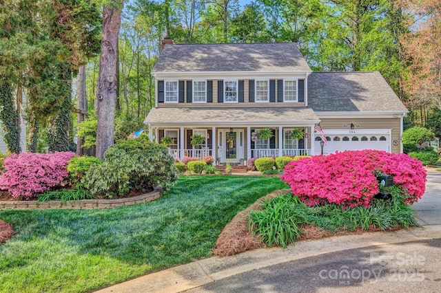 394 Runnymede Dr, Rock Hill, SC 29732 - colonial inspired home featuring covered porch, roof with shingles, a front lawn, a chimney, and a garage