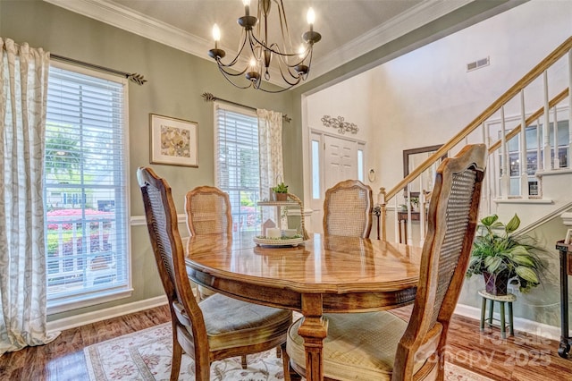 394 Runnymede Dr, Rock Hill, SC 29732 - dining room featuring crown molding, visible vents, stairway, wood finished floors, and a notable chandelier