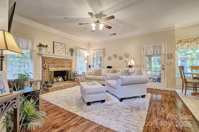 394 Runnymede Dr, Rock Hill, SC 29732 - living area featuring visible vents, a textured ceiling, wood finished floors, and ceiling fan