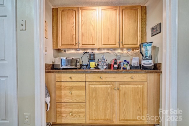 394 Runnymede Dr, Rock Hill, SC 29732 - kitchen featuring dark stone countertops, light brown cabinets, and a toaster