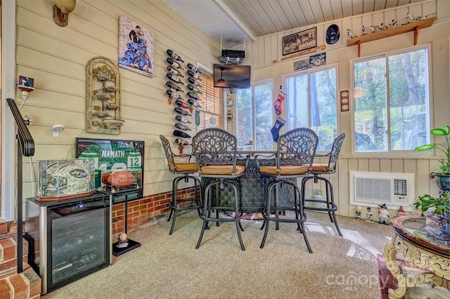 394 Runnymede Dr, Rock Hill, SC 29732 - dining area featuring wooden walls, visible vents, wooden ceiling, and carpet flooring