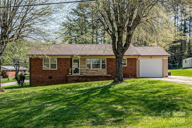 single story home with crawl space, a front yard, brick siding, a garage, and driveway