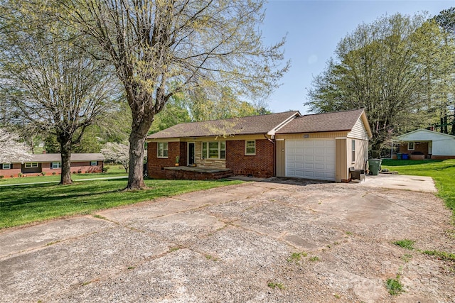 ranch-style home with a garage, concrete driveway, a front lawn, and brick siding