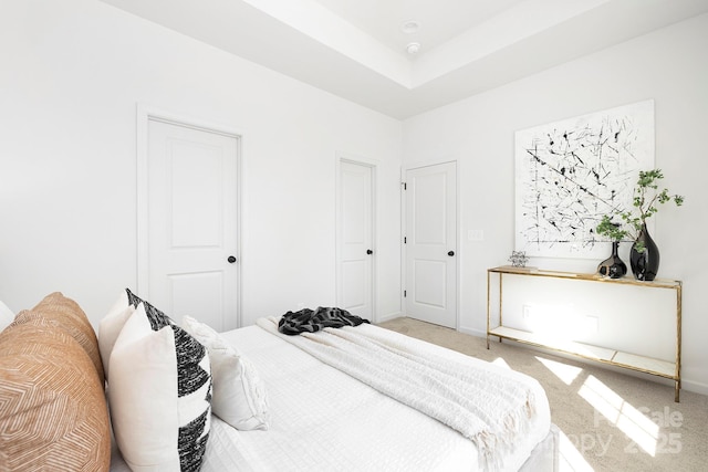 bedroom with baseboards and carpet
