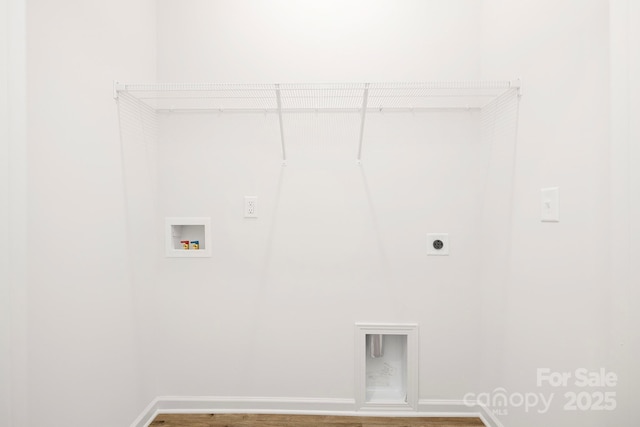 washroom featuring baseboards, laundry area, hookup for an electric dryer, wood finished floors, and hookup for a washing machine