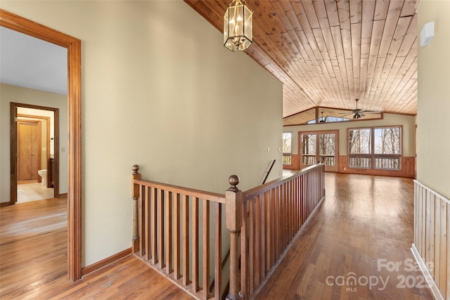 1 Sleepy Hollow Dr, Maggie Valley, NC 28751 - corridor with baseboards, an upstairs landing, lofted ceiling, wood-type flooring, and wooden ceiling