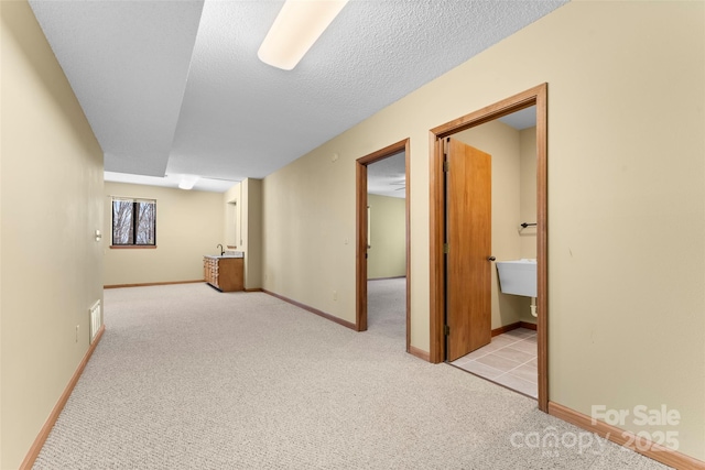 1 Sleepy Hollow Dr, Maggie Valley, NC 28751 - interior space with visible vents, a textured ceiling, baseboards, and carpet floors