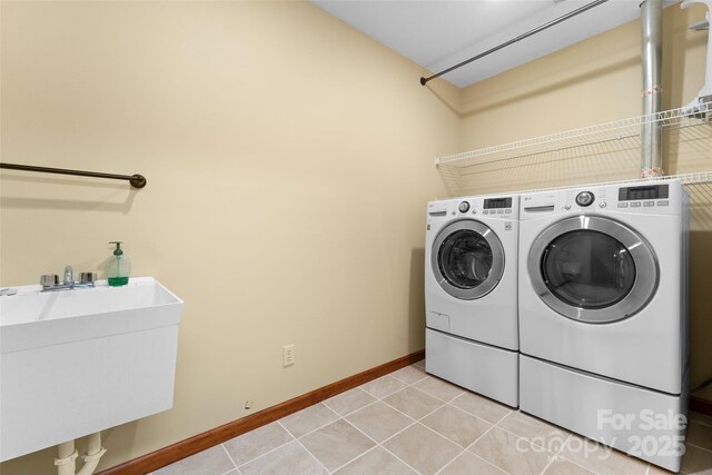 1 Sleepy Hollow Dr, Maggie Valley, NC 28751 - laundry room with a sink, light tile patterned floors, washer and clothes dryer, and laundry area