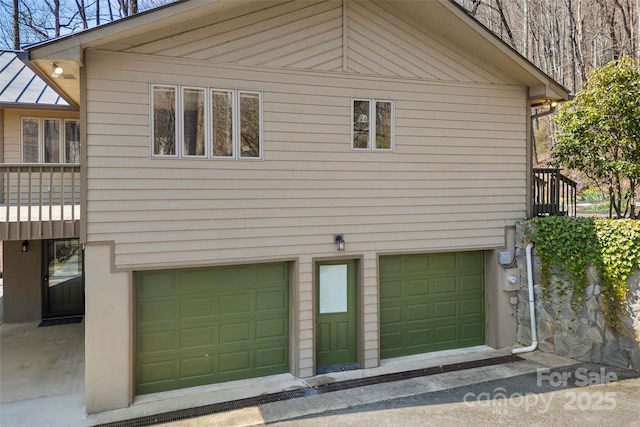 1 Sleepy Hollow Dr, Maggie Valley, NC 28751 - view of side of property featuring a garage and a standing seam roof