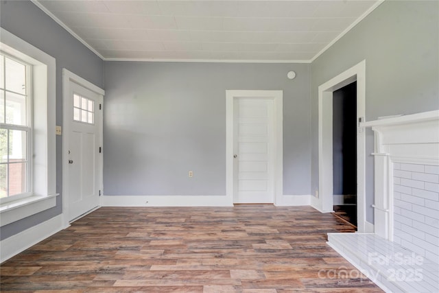 210 Moriah School Rd, Casar, NC 28020 - unfurnished living room featuring crown molding, wood finished floors, and baseboards