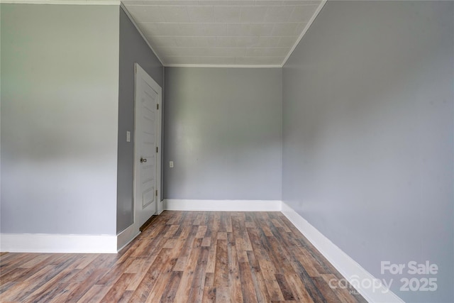 210 Moriah School Rd, Casar, NC 28020 - spare room featuring crown molding, wood finished floors, and baseboards