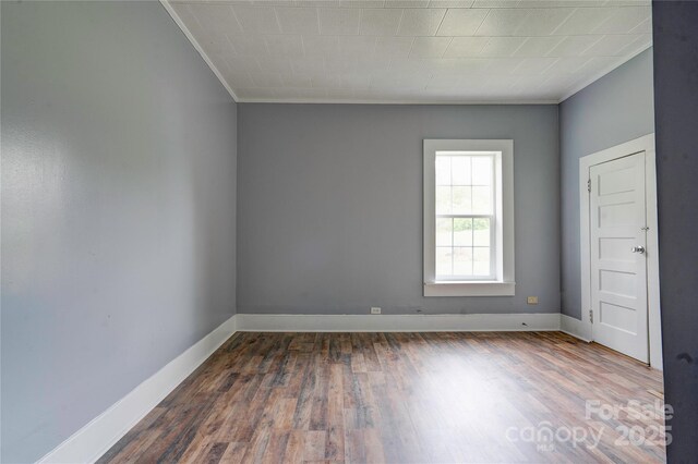 210 Moriah School Rd, Casar, NC 28020 - unfurnished room featuring crown molding, dark wood-style floors, and baseboards