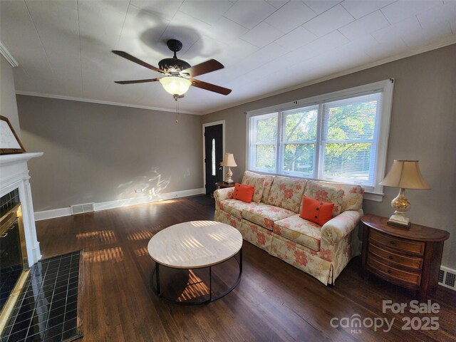 148 Palaside Dr NE, Concord, NC 28025 - living area featuring baseboards, ornamental molding, a fireplace, ceiling fan, and wood finished floors