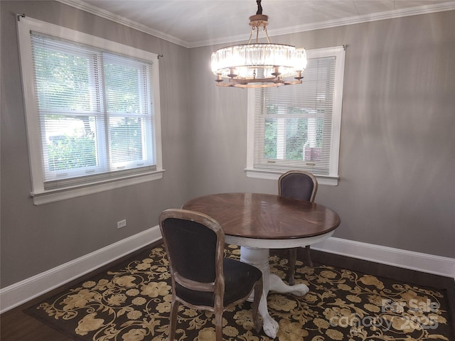 148 Palaside Dr NE, Concord, NC 28025 - dining area with a chandelier, dark wood-style floors, baseboards, and ornamental molding