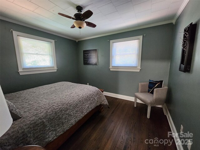 148 Palaside Dr NE, Concord, NC 28025 - bedroom with crown molding, dark wood finished floors, baseboards, and multiple windows