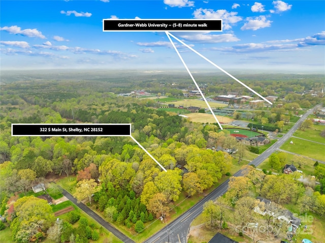 aerial view featuring a view of trees