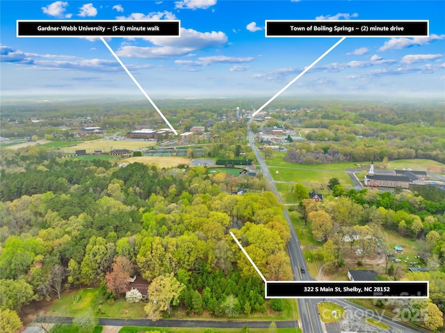 drone / aerial view with a view of trees