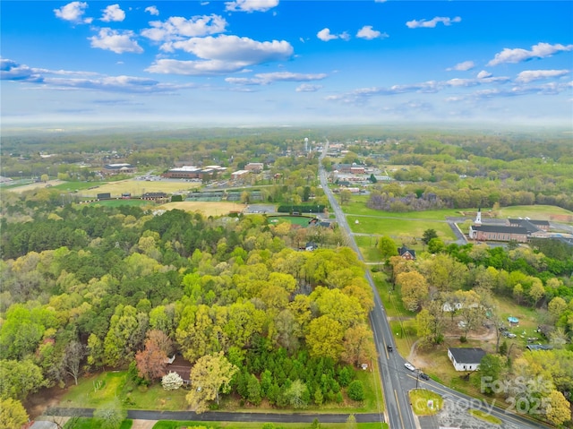 drone / aerial view with a view of trees