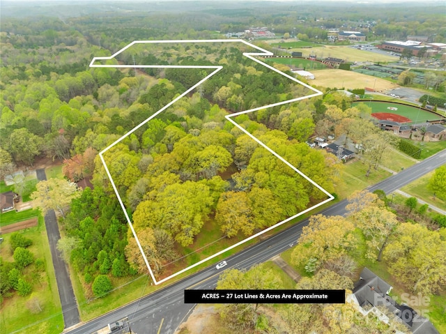 aerial view featuring a wooded view