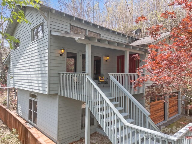 63 Chestnut Forest Rd, Fairview, NC 28730 - doorway to property featuring covered porch