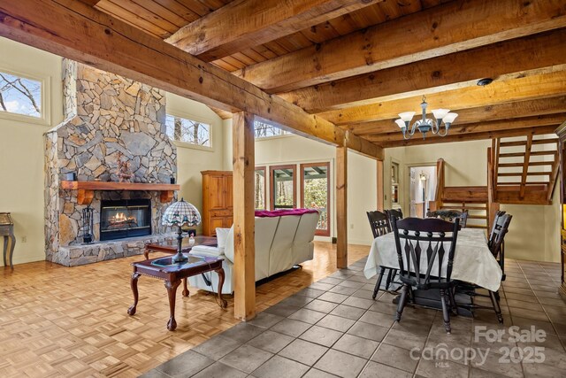 63 Chestnut Forest Rd, Fairview, NC 28730 - dining space with an inviting chandelier, wood ceiling, beamed ceiling, and a stone fireplace