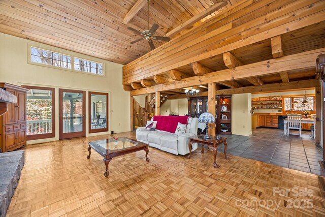 63 Chestnut Forest Rd, Fairview, NC 28730 - living area featuring stairway, ceiling fan, a towering ceiling, and wood ceiling