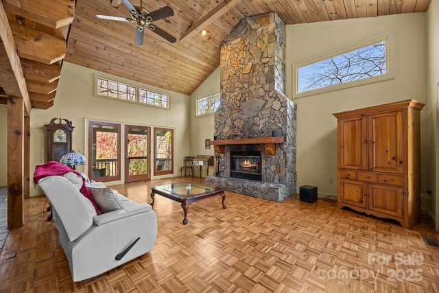 63 Chestnut Forest Rd, Fairview, NC 28730 - living room featuring a fireplace, wood ceiling, high vaulted ceiling, and a ceiling fan