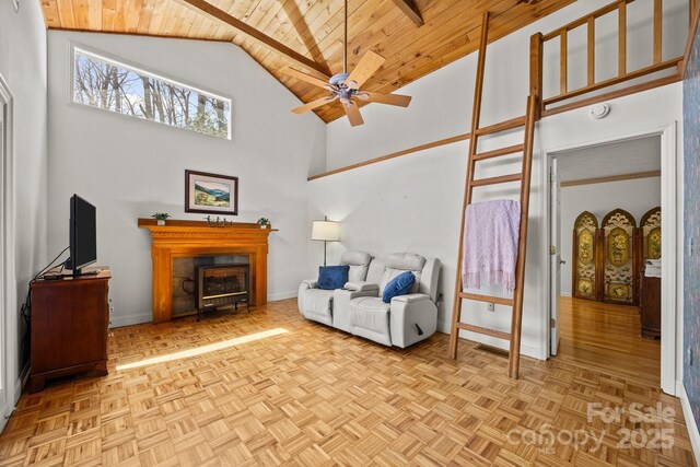 63 Chestnut Forest Rd, Fairview, NC 28730 - living room with wood ceiling, high vaulted ceiling, a fireplace, baseboards, and ceiling fan