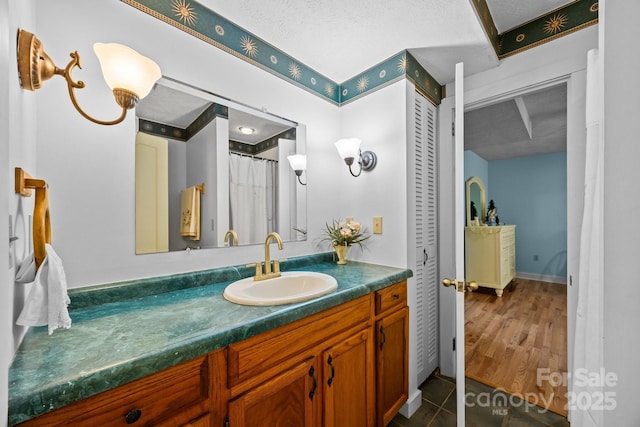 63 Chestnut Forest Rd, Fairview, NC 28730 - bathroom featuring vanity, a textured ceiling, and baseboards