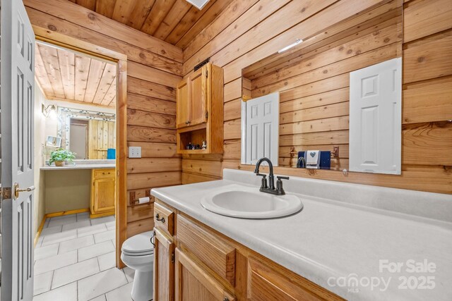 63 Chestnut Forest Rd, Fairview, NC 28730 - bathroom featuring wooden ceiling, vanity, toilet, and tile patterned floors