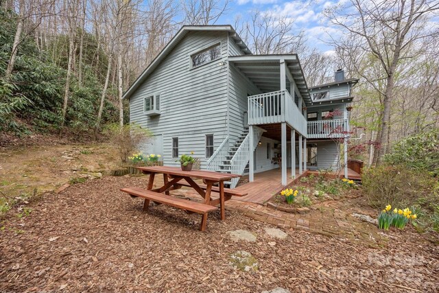 63 Chestnut Forest Rd, Fairview, NC 28730 - back of house with stairway, a wooden deck, and outdoor dining space