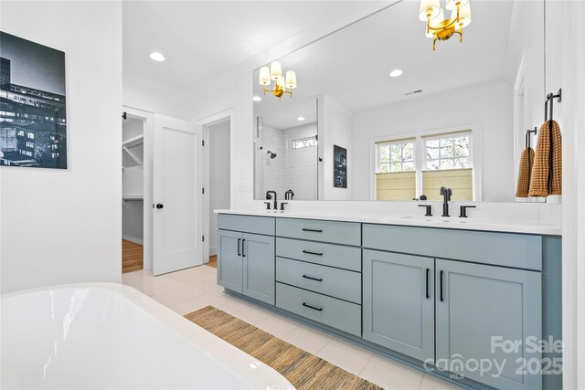 210 Walford Dr, Charlotte, NC 28208 - bathroom with a shower stall, recessed lighting, double vanity, and a sink