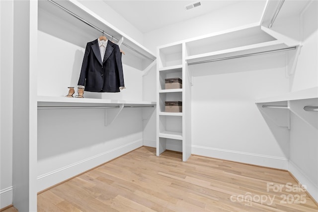 210 Walford Dr, Charlotte, NC 28208 - walk in closet with visible vents and wood finished floors