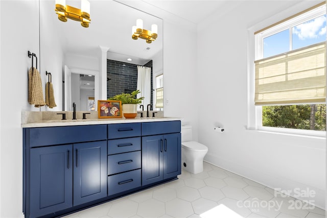 210 Walford Dr, Charlotte, NC 28208 - bathroom with toilet, double vanity, a sink, and a shower