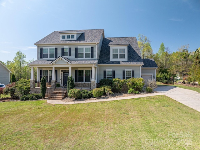6352 Willow Farm Dr, Denver, NC 28037 - view of front of property featuring a garage, driveway, a front lawn, and covered porch