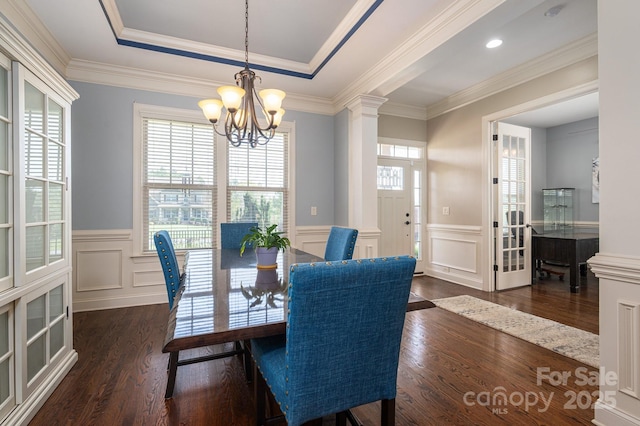 6352 Willow Farm Dr, Denver, NC 28037 - dining room with a notable chandelier, a raised ceiling, a decorative wall, wainscoting, and dark wood-style flooring