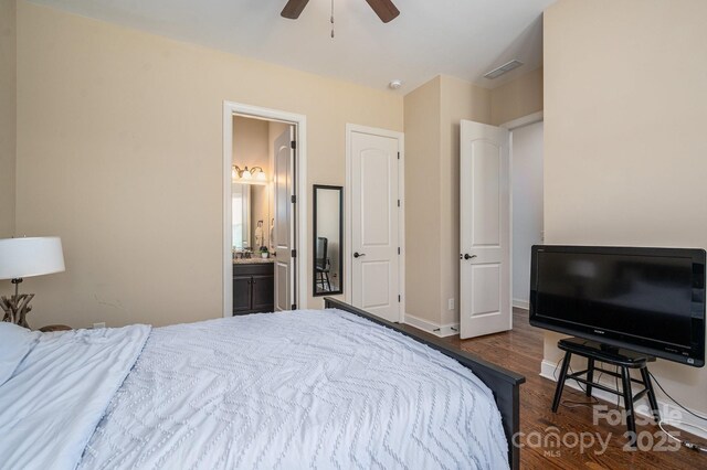 6352 Willow Farm Dr, Denver, NC 28037 - bedroom with ensuite bathroom, baseboards, visible vents, a ceiling fan, and dark wood-type flooring