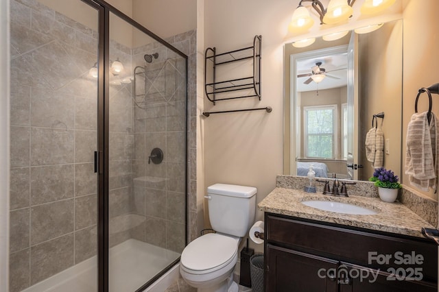 6352 Willow Farm Dr, Denver, NC 28037 - bathroom with a shower stall, connected bathroom, vanity, ceiling fan, and toilet