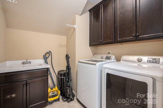 6352 Willow Farm Dr, Denver, NC 28037 - washroom with washing machine and clothes dryer, a sink, light tile patterned floors, and cabinet space
