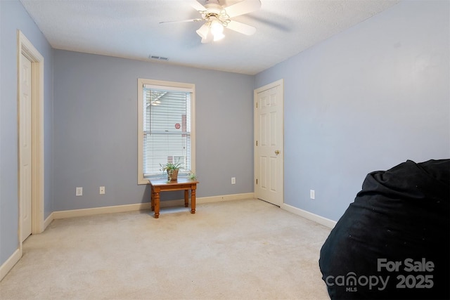 1050 Merrywood Dr, Newton, NC 28658 - living area with ceiling fan, a textured ceiling, visible vents, light carpet, and baseboards