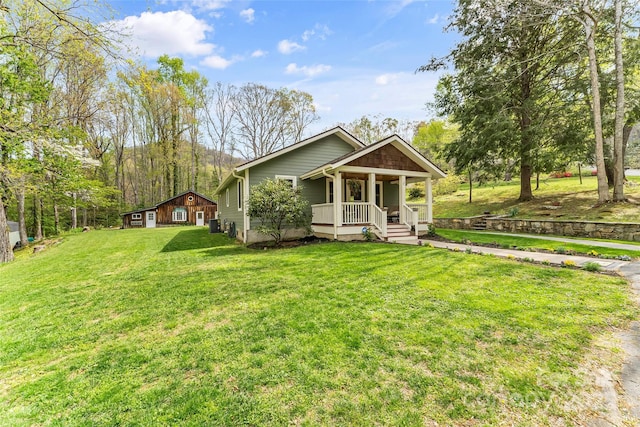 view of front of home with a front lawn and covered porch