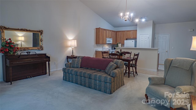 living area featuring high vaulted ceiling, a notable chandelier, light carpet, and baseboards
