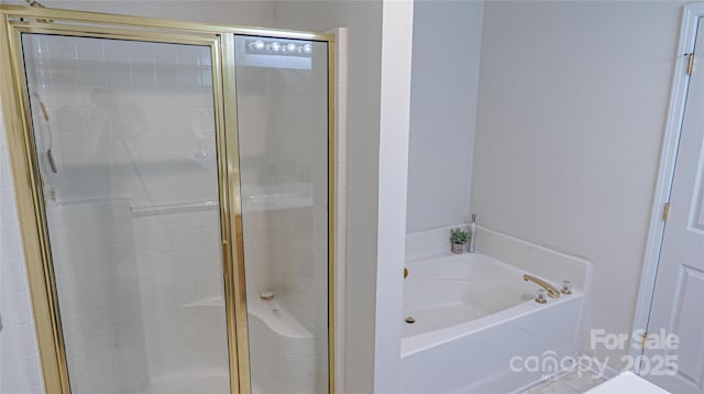 full bathroom with a stall shower and a garden tub