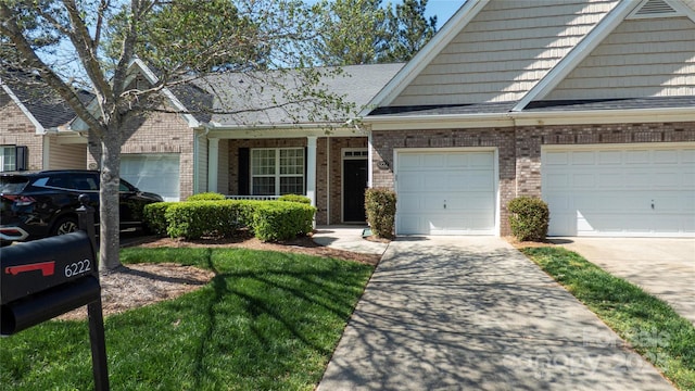 view of front of home with brick siding, driveway, and a shingled roof