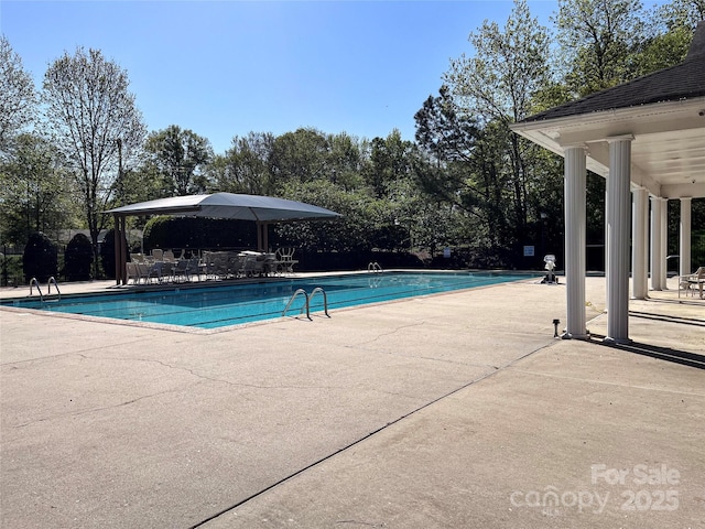 pool with a patio area