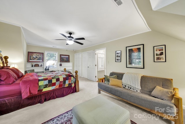bedroom with a closet, carpet, a ceiling fan, and visible vents