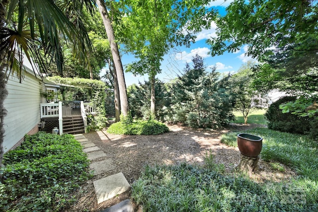 view of yard with a wooden deck